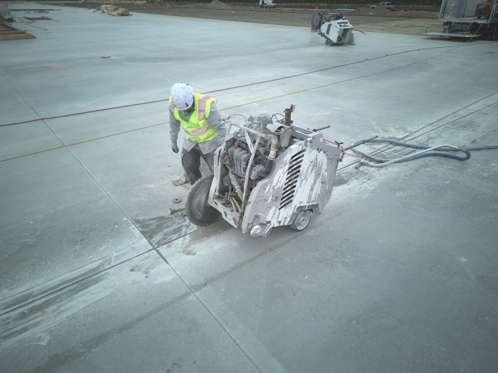 Aerial view of flat saw concrete cutting with water slurry