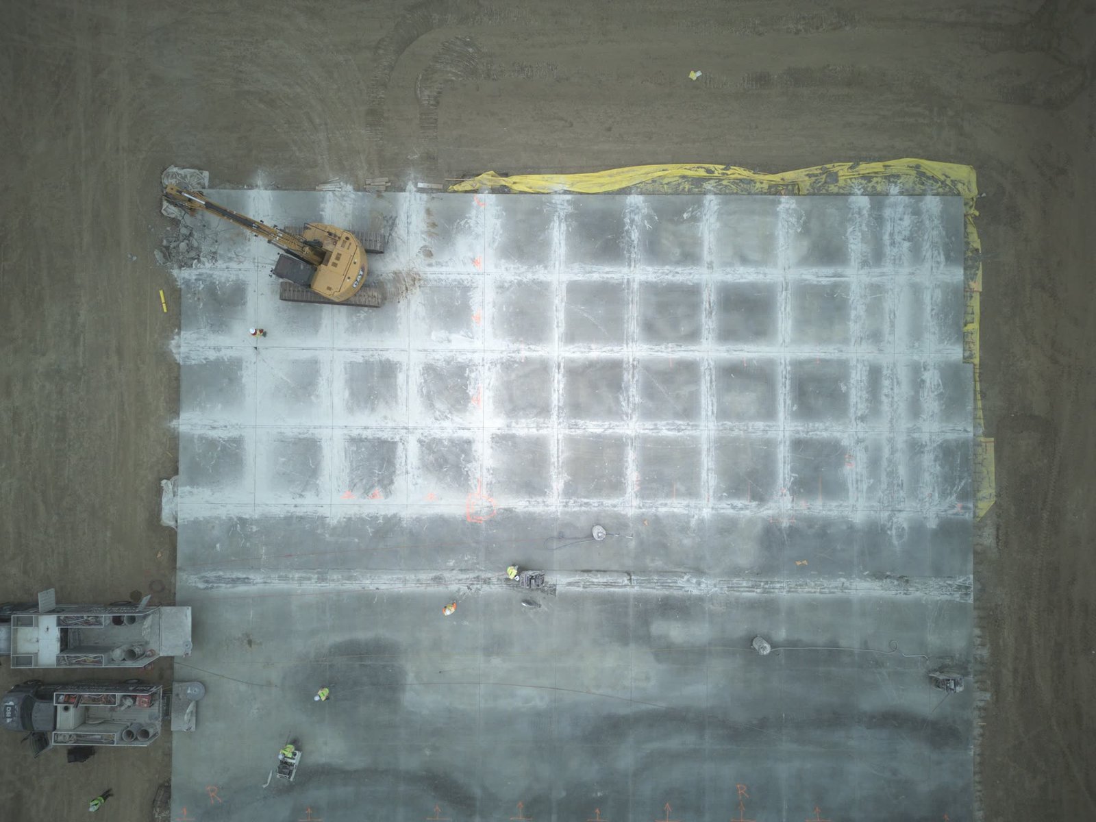 Top-down aerial of concrete slab demolition grid pattern