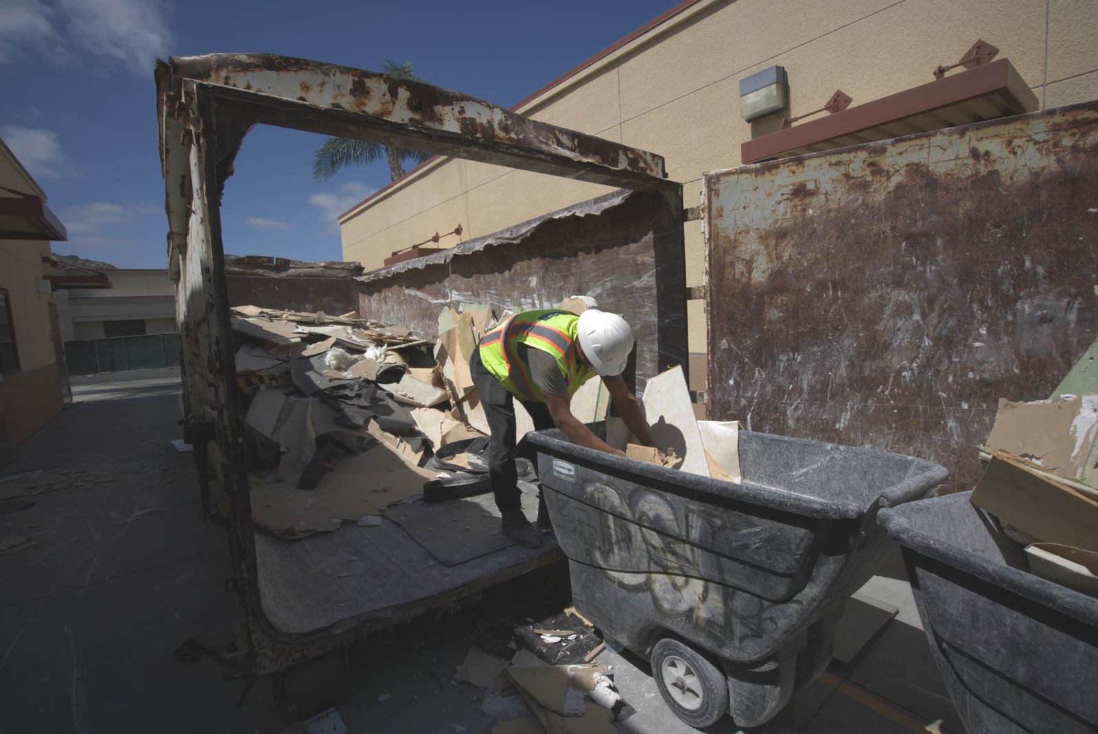 DSI crew loading demolition debris